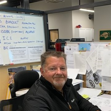 Dean Brown at his desk in the Alloway office